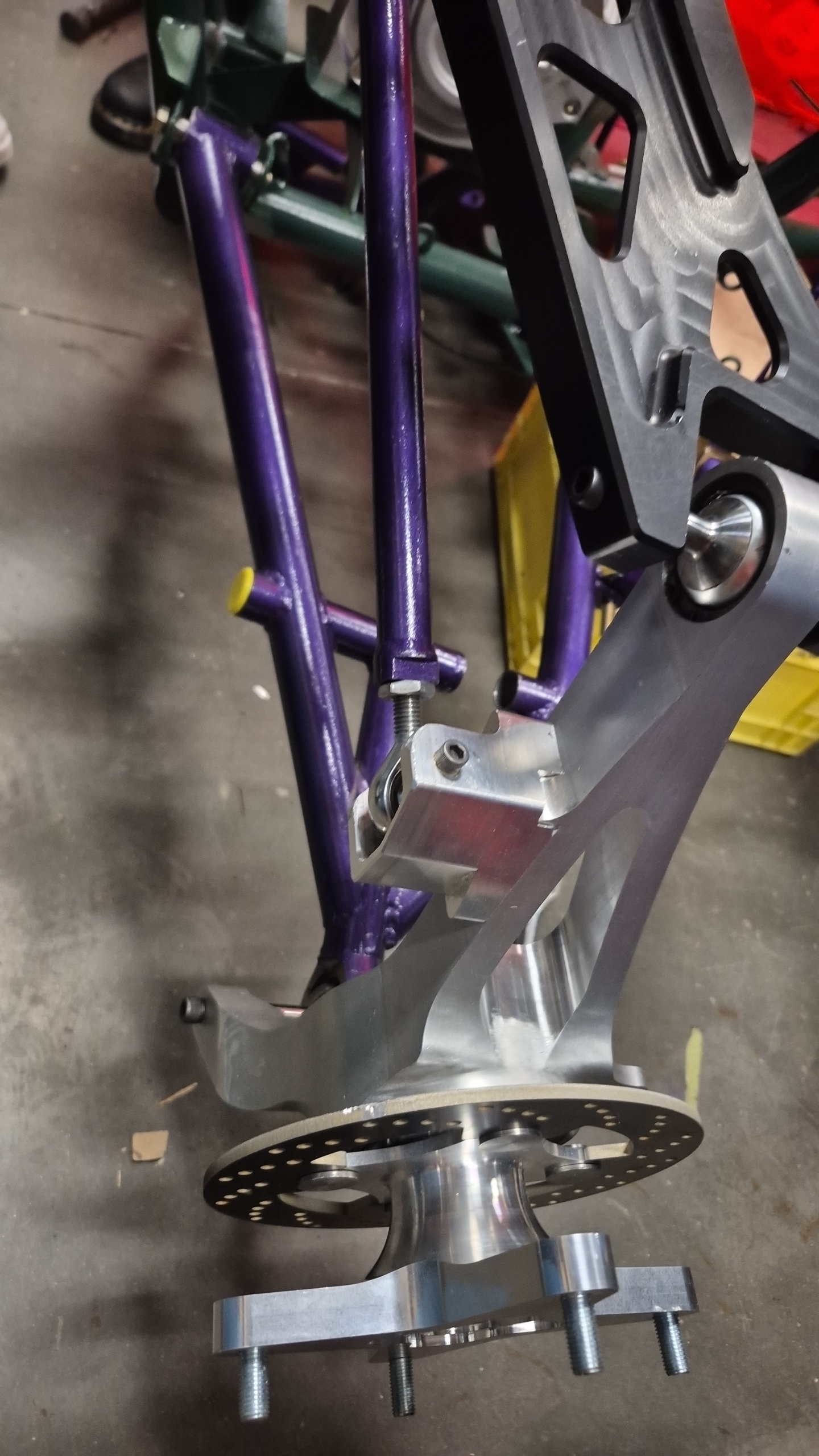 Tie rod tab mounted on upright installed on the car.