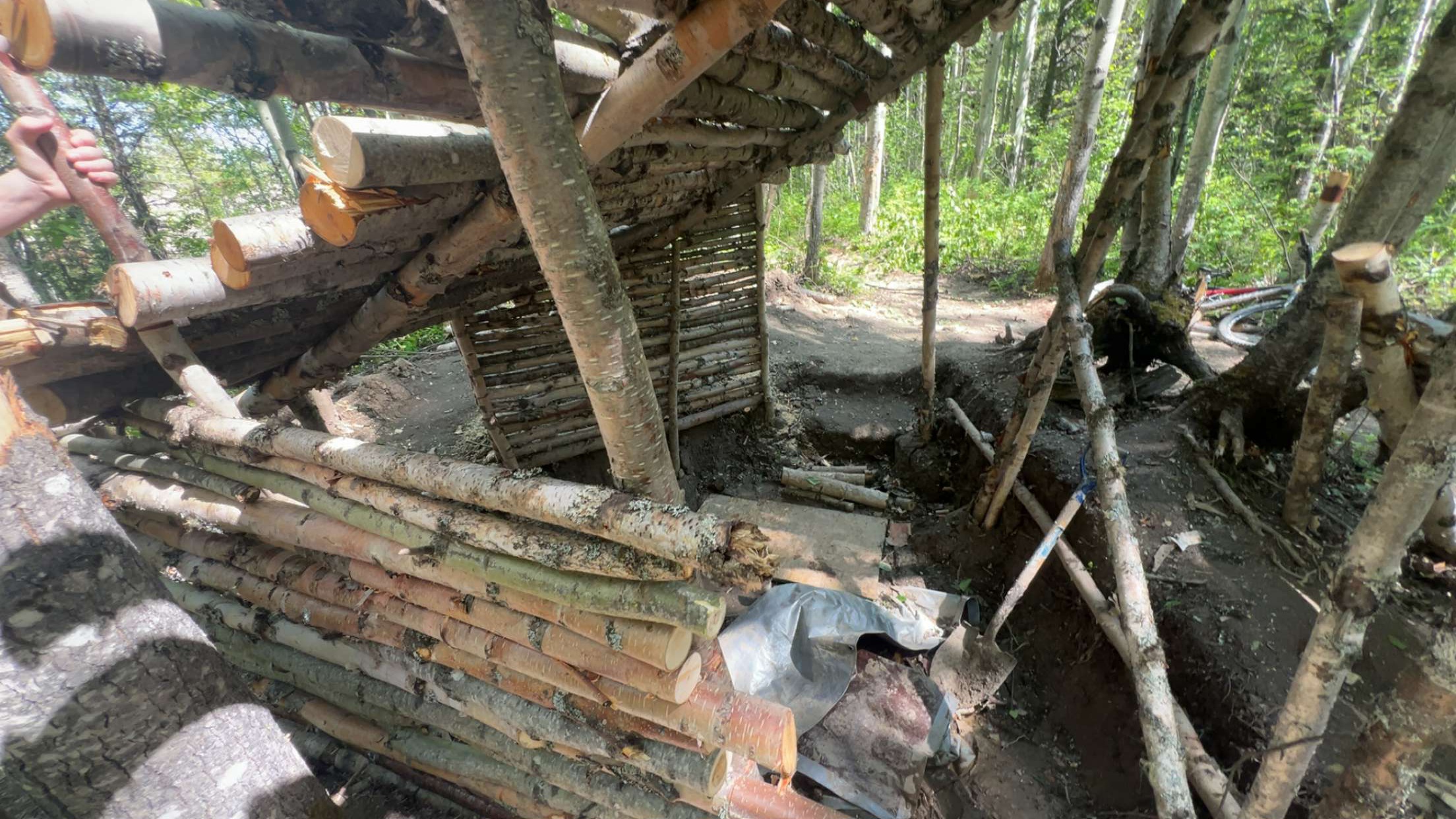 Hut wall progress during construction.