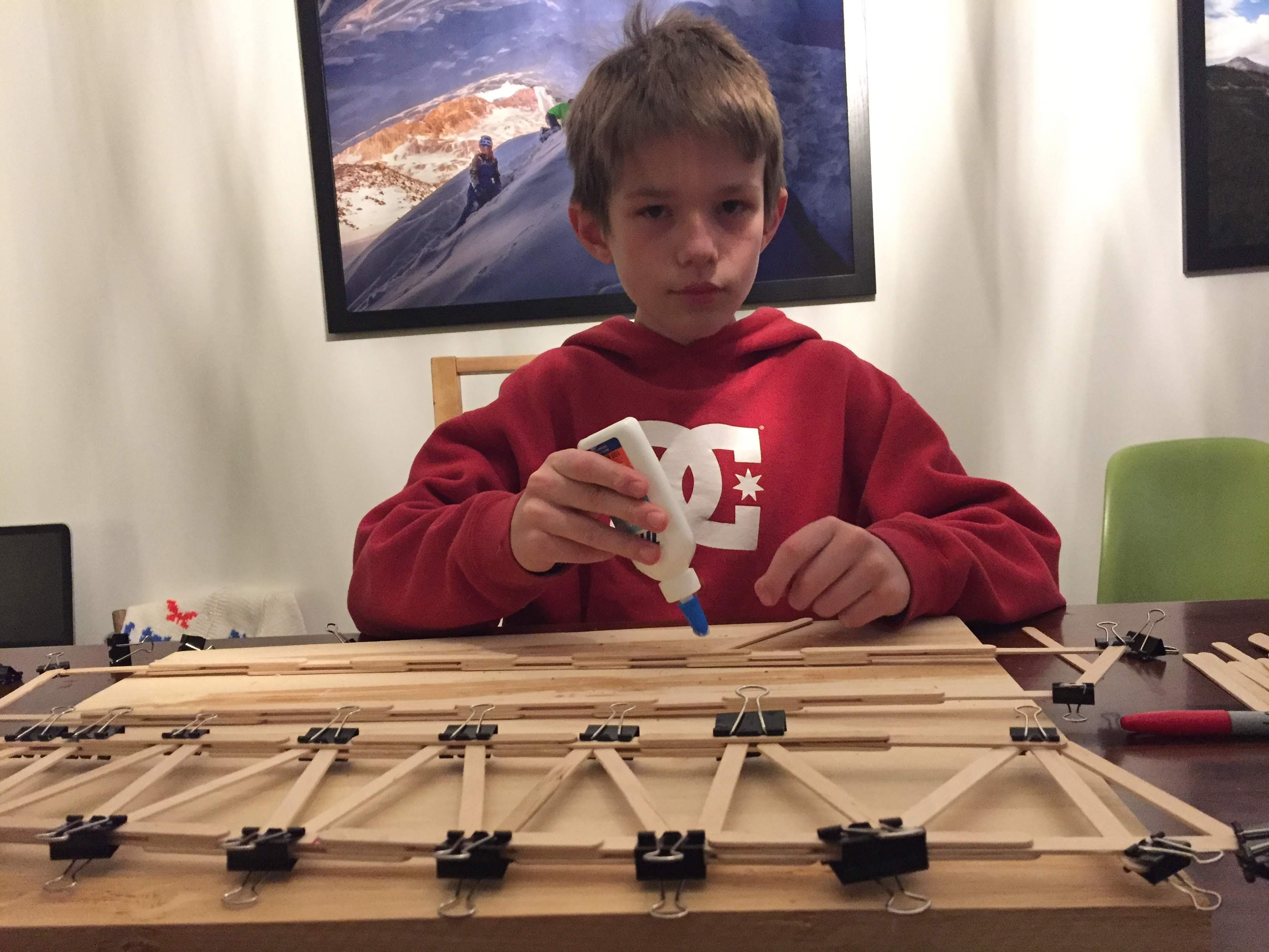 Young Aiden building with LEGO Technic